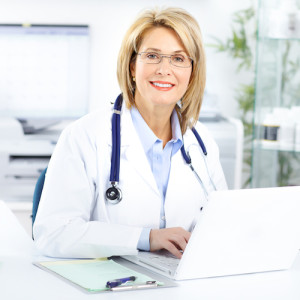 female doctor at desk with computer